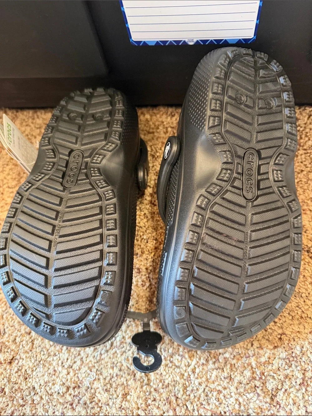 black Crocs Classic Lined Clog warm, fuzzy black interior lining. Size m2/w4